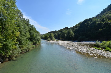 Fototapeta na wymiar Clanezzo, Antico Porto Fluviale e Passerella sul fiume brembo, in val brembana, Bergamo, Lombardia, Italia