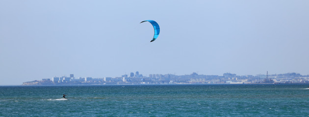 Kitesurfing, water skiing with parachuting