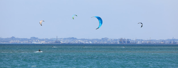 Kitesurfing, water skiing with parachuting