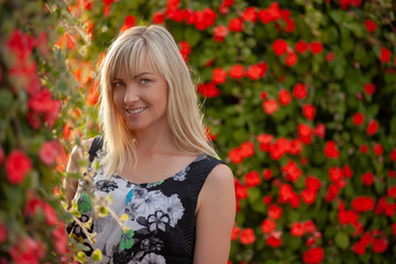 Naklejka premium Young blond girl in dark dress