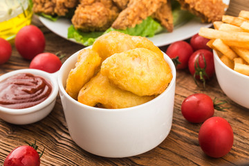 Vintage wooden table with fresh made Chicken Nuggets
