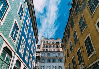 Lisbon windows with typical portuguese tiles on the wall