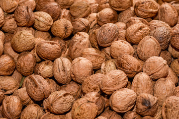 Full frame of natural walnuts as backdrop