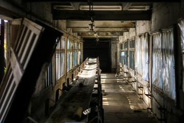 conveyor belt in the interior of an old abandoned house