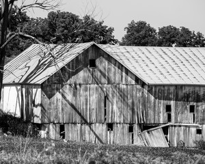 Old broken down black and white barn.