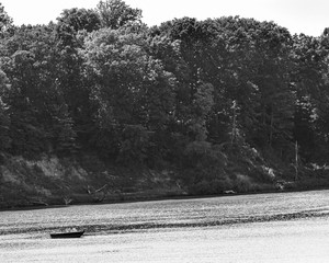 Black and white boat in a big lake.