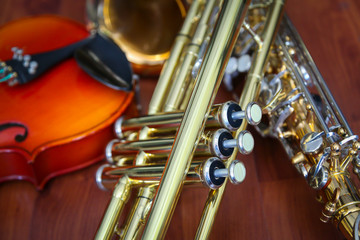 Stack of musical instruments - violin and  trumpet
