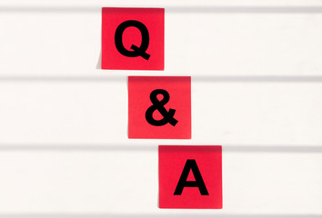 Q and A text word inscription acronym on papers