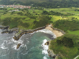 Fototapeta na wymiar Asturias. Coastal cliffs landscape in beach of Cue.Spain. Aerial Drone Photo