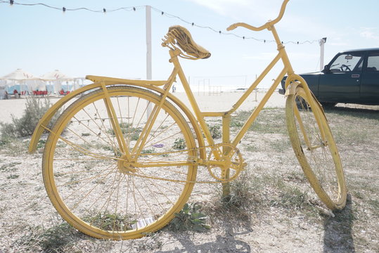 old bicycle painted in yellow for decoration