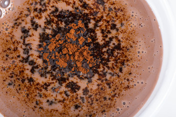 Naklejka premium Mug with coffee or chocolate close-up background 