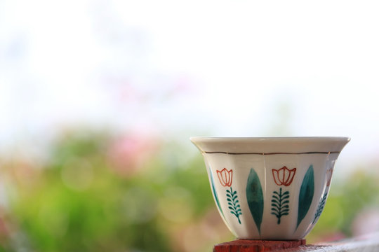 Lebanese Coffee Cup on Floral Background