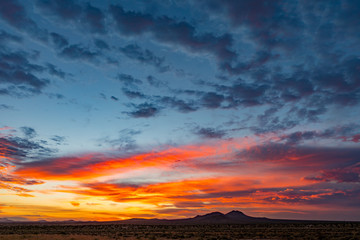 Fototapeta na wymiar Fiery Sunset in the mountains Mojave Desert