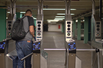New York City MTA Subway Station Person Walking Through Turnstile with Metrocard