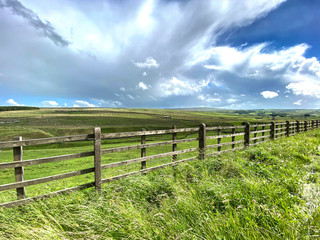 Fototapeta na wymiar Landscape view, from the Keighley road, with moors grasses, and heavy cloud near, Monkroyd, Colne, UK