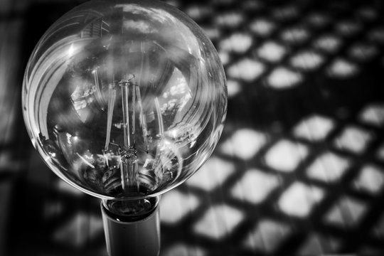 A close-up of a lightbuld in black and white