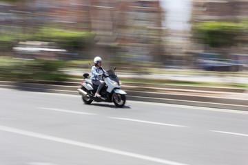 Motorcycle moving through the city.