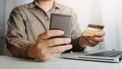 businesswoman hand using smart phone, tablet payments and holding credit card online shopping, omni...