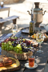 Breakfast table with apple pie, tea glass, outdoors. Homemade Apple Pie