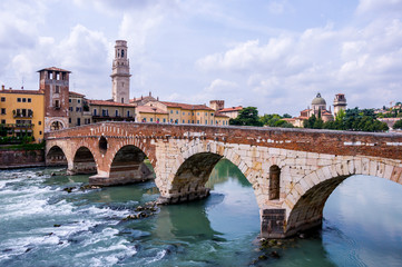 Ancient Roman Bridge called Ponte di Pietra on Adige River in Verona, Northern Italy.