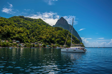 A view past boats moored in Soufriere Bay towards Petit Piton in St Lucia