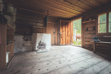 Abandoned mountain hut or chalet in Austria: rustic wooden interior