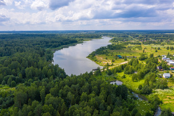 Fototapeta na wymiar A large reservoir near the village of Ushakovka, Ivanovo region on a summer day.