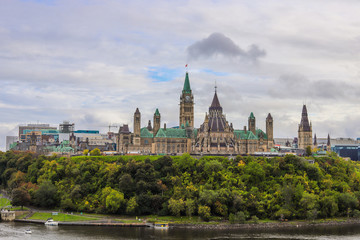 Parliament Hill, Ottawa, Rideau canal in Autumn. Cloudy sky