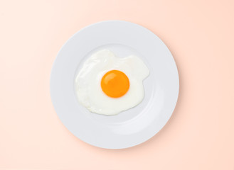 fried egg on beige background