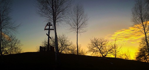 Orthodox cross at sunset