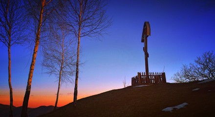 Orthodox cross at sunset