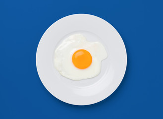 fried egg on blue background