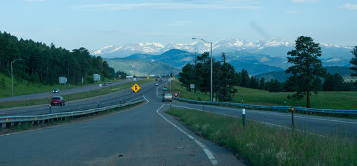 Merging onto highway with mountains in view in windshield