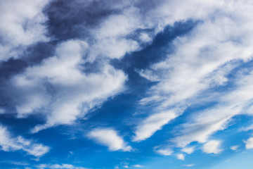 Naklejka na ściany i meble Blue sky with white gray clouds. I