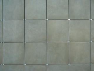 Background of wall  made of gray square tiles