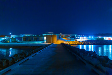 Obraz premium Night photo of Reykjavik city beach. Waterfront lights