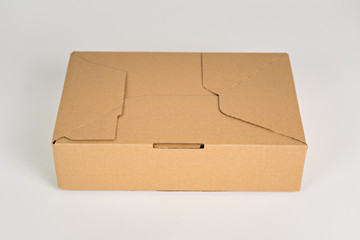 Brown mailer box 300x200x80 on the white background