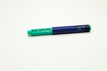insulin pen on a white background, for hormone therapy for patients with diabetes