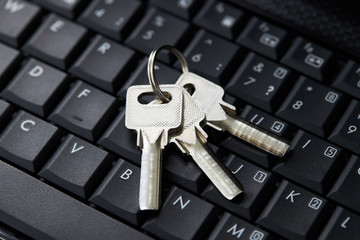 keys on a black laptop keyboard over white background. internet security concept. antivirus software concept. electronic wallet symbol