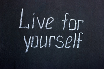 Obraz premium Chalk lettering on a blackboard Live for yourself