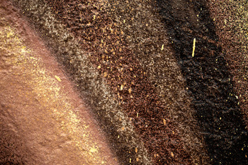 brown-gold texture with drops and splashes