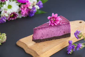 Homemade cheesecake with fresh blueberries and mint for dessert - healthy organic summer dessert pie cheesecake. Creative atmospheric decoration