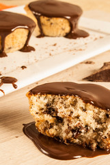 Chocolate  cake with melted chocolate on the top.