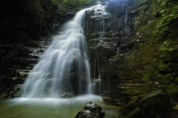 
waterfall in a wild place in the Carpathians