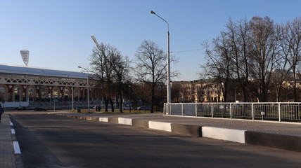 Fototapeta na wymiar autumn MInsk central street with buildings and quayside