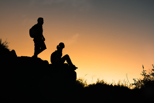couple enjoying the nature senery on mountain edge  
