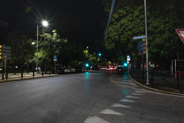 Timelapse view of traffic at an urban night intersection. Urban movement in the Italian city in the evening. Traffic lights. Time Lapse. 4K video