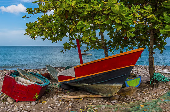 A view of traditional fishing boats pulled up on the beach in Grenada