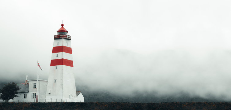 Beautiful Old lighthouse In Misty Day, located on Skrova Island, Lofoten Islands, Norway, Panoramic View
