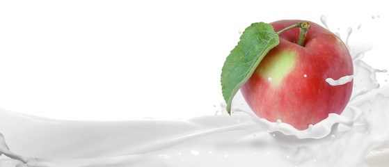 Fototapeta na wymiar Ripe apple in a splash of yogurt